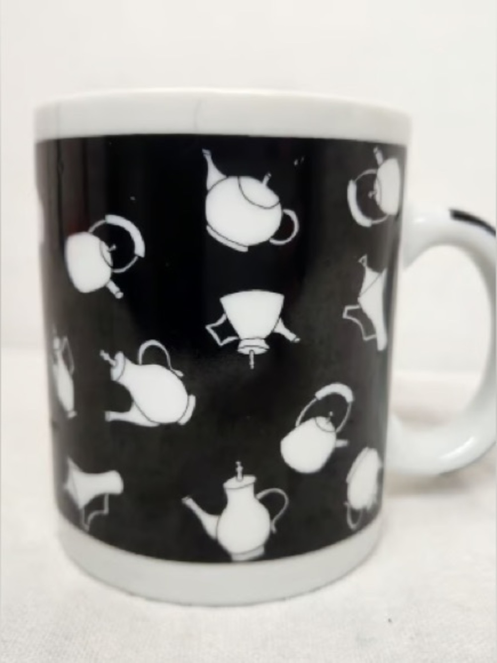 Black Ceramic Mug with White Teapot Pattern - Unbranded